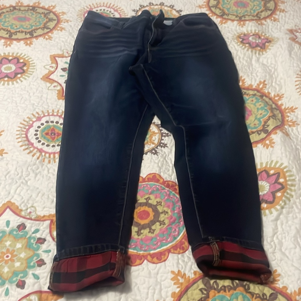 Maurice’s size18W dark wash mid rise m jeans with a buffalo plaid cuff.